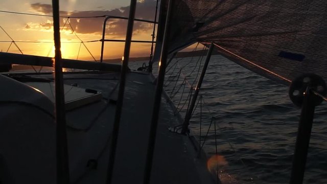 sailing into the sunset with the bow waves splashing