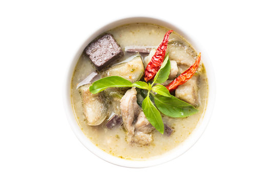Green curry chicken (Kang Keaw Wan Gai) in a bowl isolated on white background, top view, Thai food