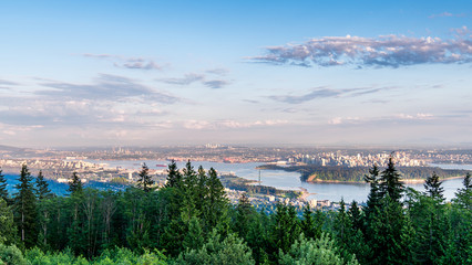 Fototapeta na wymiar Beautiful British Columbia, Canada. Vancouver seen from above. Wide panorama of the city.