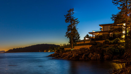 Sunset over a beautiful house in West Vancouver, British Columbia, Canada.