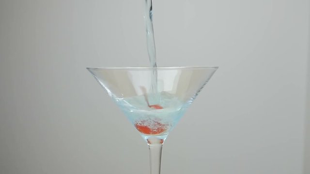 Blue Hawaii Cocktail with red cherries 