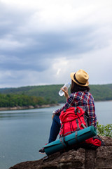 Young woman watching and Take a photo landscape,.backpacker.