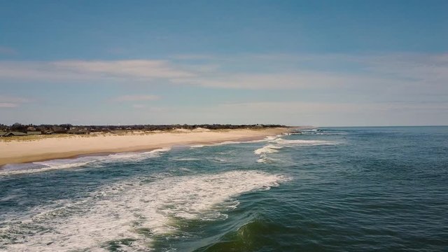 Slow Moving Aerial Drone Shot Moves Away From Beach On East Hampton Main Beach