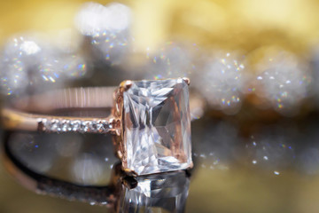 Luxury Jewelry diamond and pink topaz ring with reflection on black background