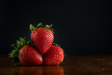 Strawberries fruit with black background