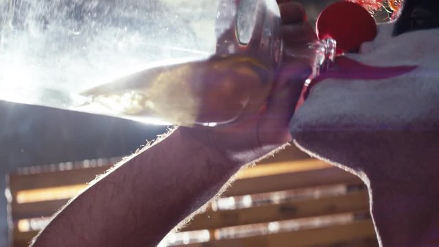 Low angle clown heavily drinking alcohol from glass bottle