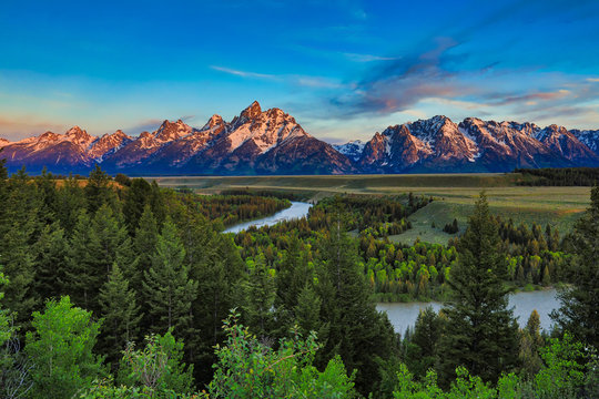 Sunrise view of the Grand Tetons from the Snake River overlook in Jackson Hole, Wyoming.
