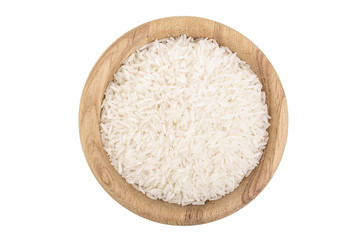 rice grains in wooden bowl isolated on white background. Top view. Flat lay
