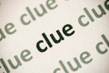 word clue printed on paper macro