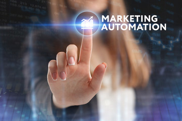 The concept of business, technology, the Internet and the network. A young entrepreneur working on a virtual screen of the future and sees the inscription: Marketing automation
