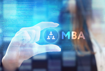 The concept of business, technology, the Internet and the network. A young entrepreneur working on a virtual screen of the future and sees the inscription: MBA