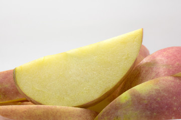 Close-up apple red knife dissect on white background