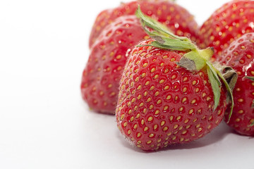 Group of red strawberries on white background