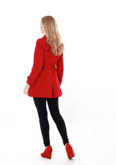 portrait of pretty blonde girl wearing red trench coat, full length standing pose.. isolated on...