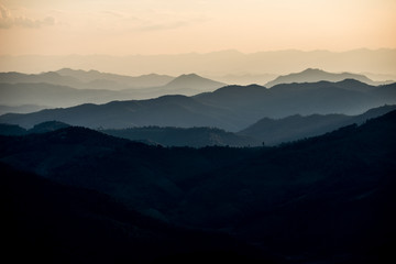 Beautiful landscape layer of mountains in sunset time, North of THAILAND