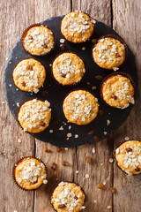 Low-calorie muffins of oatmeal with raisins and honey close-up. vertical top view from above