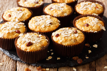 Healthy sweet snack: muffins of oatmeal with raisins close-up on the table. horizontal