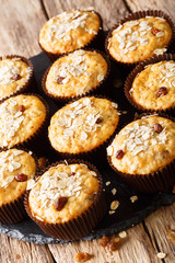 Delicious muffins of oatmeal with raisins close-up. vertical