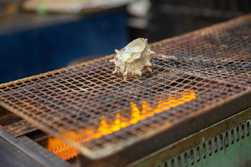 Japanese shellfish grill in fresh market street.
