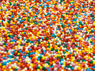 Fototapeta na wymiar Multicolored pills for decoration baking close-up, background