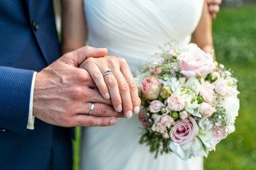 Obraz na płótnie Canvas hands groom and bride with wedding rings celebration love symbol