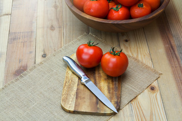 Closeup Fresh ripe tomatoes on wood background