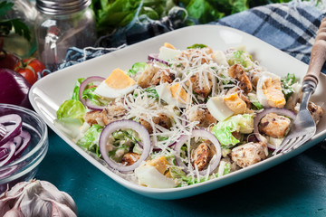 Healthy caesar salad with cheese, eggs and croutons