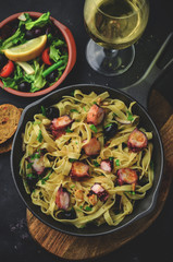 Tasty pasta with grilled octopus and herbs