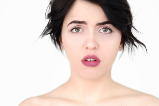 Emotion Face. Worried Alarmed Agitated Woman. Young Beautiful Brunette Girl Portrait On White Background.