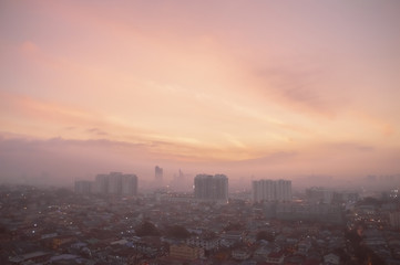 Aerial panorama at orange sunrise of Petaling Jaya, suburb of Kuala Lumpur, Malaysia