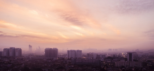 Fototapeta premium Aerial panorama at orange sunrise of Petaling Jaya, suburb of Kuala Lumpur, Malaysia
