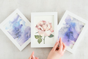 Fototapeta premium creative leisure. painting hobby. artful personality. talented watercolor abstract drawings and picture of a rose