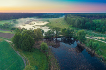 Early morning, wilderness. Aerial view of countryside and river