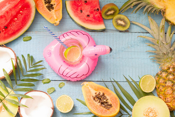 Tropical holiday summer abstract background with palms  fruits drink and flamingo
