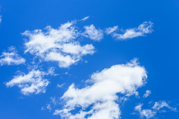 Obraz premium White fluffy clouds in a deep blue sky