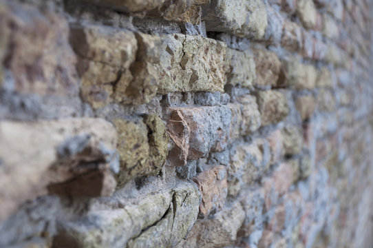 wall texture with an old broken brick