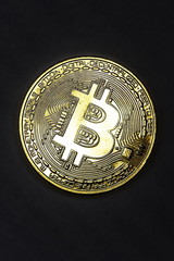 Bitcoin cryptocurrency chart on tablet pc with arrow pointing down, recession. Sharp falling stock...