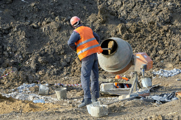 Builder mixes concrete