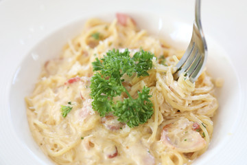 Spaghetti white sauce (Spaghetti Carbonara) with bacon and garlic , on wood table background
