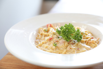 Spaghetti white sauce (Spaghetti Carbonara) with bacon and garlic , on wood table background