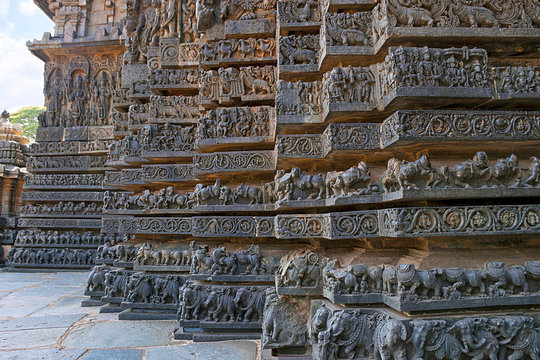 Friezes of animals, scenes from mythological episodes from Ramayana and Mahabharata, at the base of temple, Hoysaleshwara temple, Halebidu, Karnataka