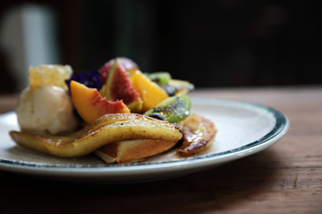 Dessert baked Waffle with fruits kiwo grape berry and vanilla ice cream vintage style