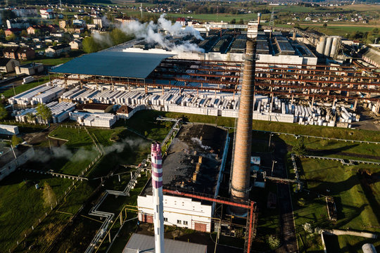 Aerial view of modern large industrial factory with smokestack, 