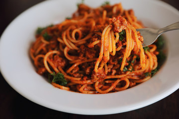 Spaghetti bolognese on wood background , italian food