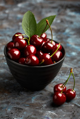 Fresh red cherry on a dark background. Cherries. Healthy food concept.