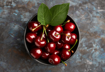 Fresh red cherry on a dark background. Cherries. Healthy food concept.
