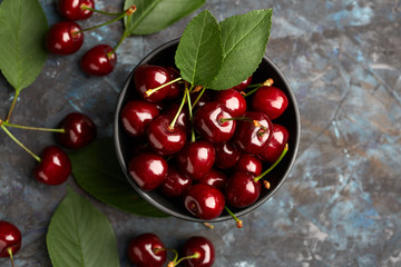 Fresh red cherry on a dark background. Cherries. Healthy food concept.