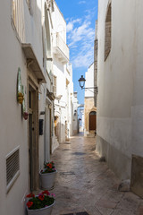 A scenic narrow street in the centre of Locorotondo, Apulia, Italy