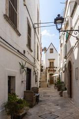 A scenic narrow street in the centre of Locorotondo, Apulia, Italy