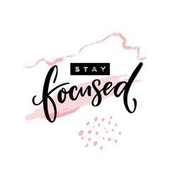 Stay focused inscription. Motivational quote, handwritten calligraphy and embossed tape text on abstract pink brush strokes. Poster print design.